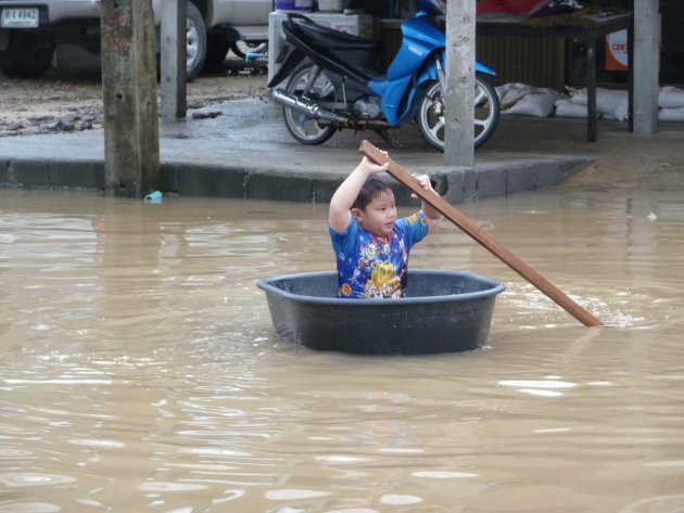 little boy having fun in the rain, Koh Samui