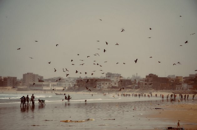 Strandleven en vissers.