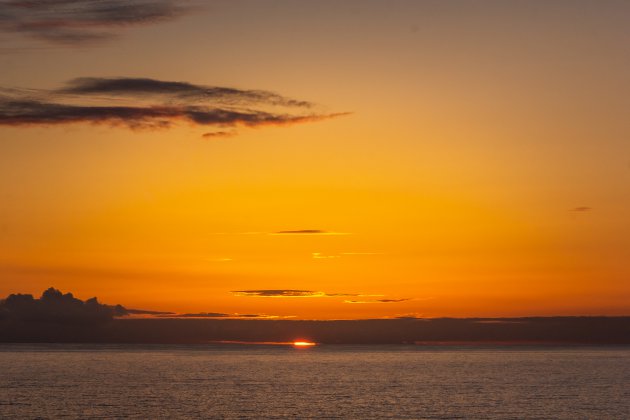 Als de zon de zee kust