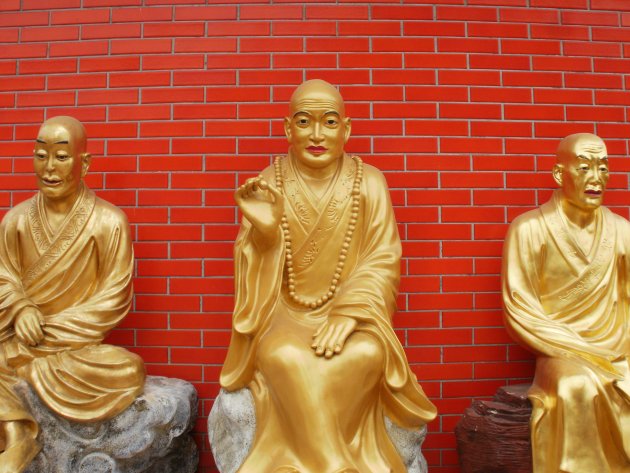 Drie gouden Buddha's 