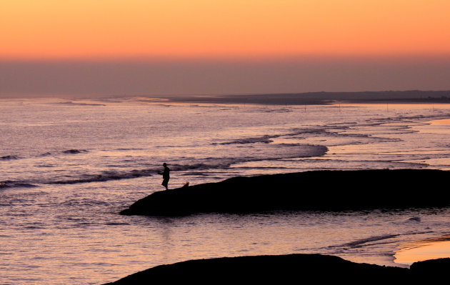 Visser bij de zee